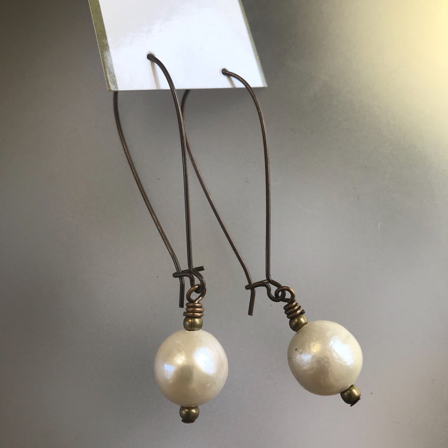 Single pearl earrings